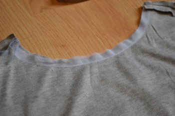 Stay-tape on the front, sewn to the wrong side of the fabric, about 1/2" in.